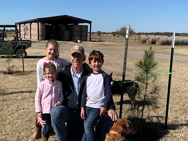 Family with dogs on ranch